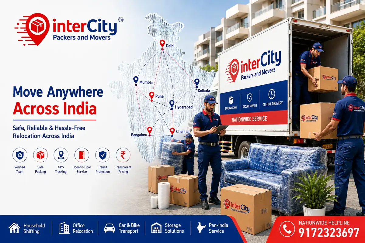 Two uniformed InterCity Packers and Movers crew members loading labelled cartons and a plastic-wrapped sofa into a white moving truck outside an Indian apartment building, beside a map of India marking Delhi, Mumbai, Pune, Bengaluru, Hyderabad, Chennai and Kolkata